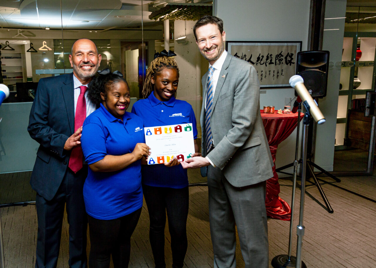 Councilmember Charles Allen, CEO and students at event.