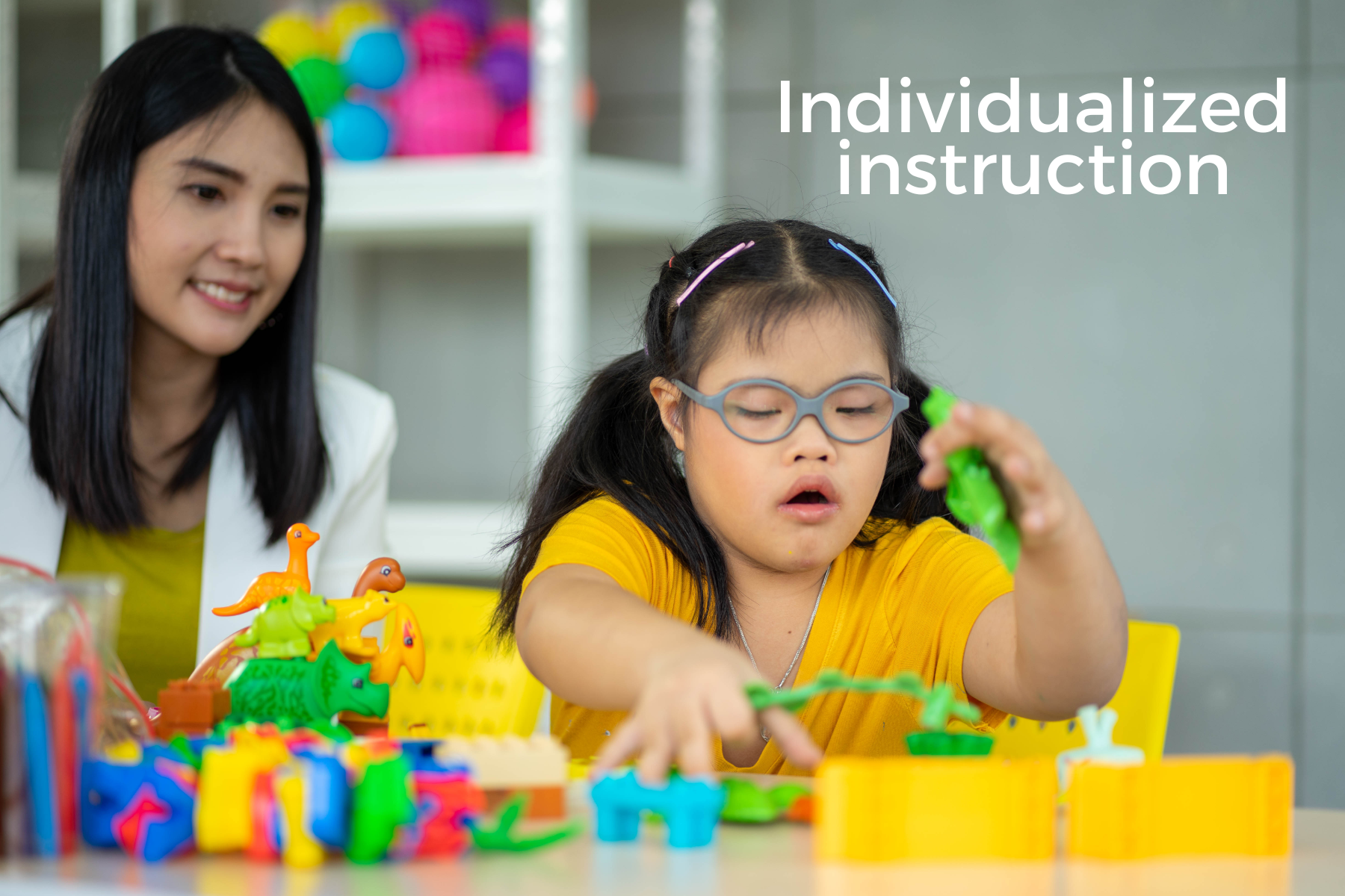 classroom setting teacher and girl with a puzzle